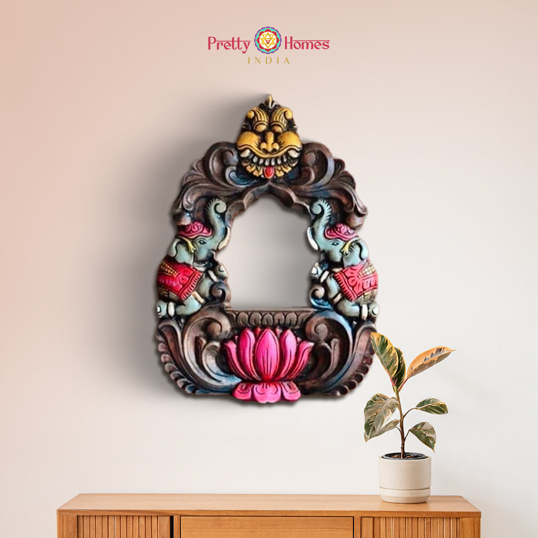 Handcarved mahogany frame with parrot and elephant design mounted on wall