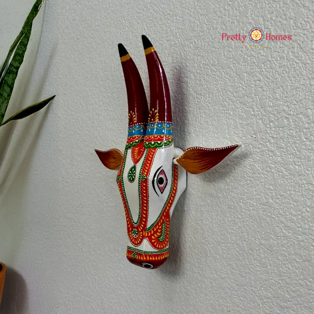 Traditional wooden cow head wall hanging hand-painted in multicolour tones