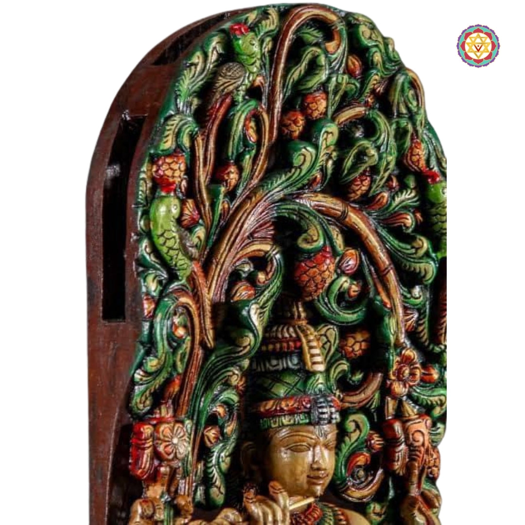 Intricate top canopy carving with vine and leaf pattern
