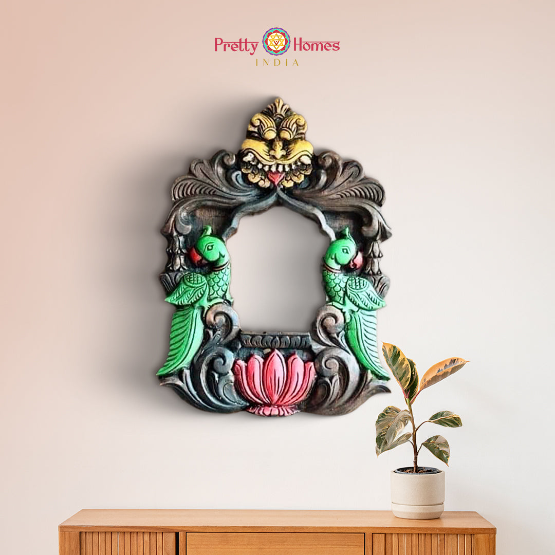 Close-up of colorful wooden wall frame with floral and bird motifs