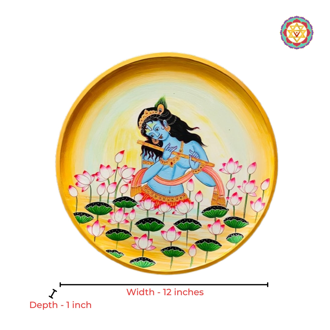 Close-up view of flute Krishna round pichwai painting with sacred cow motifs