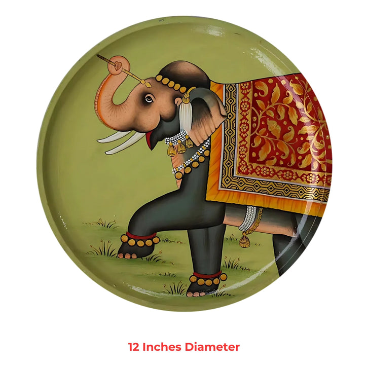 hand-painted round plate with an ornate elephant motif, gilt accents and traditional textile patterns.