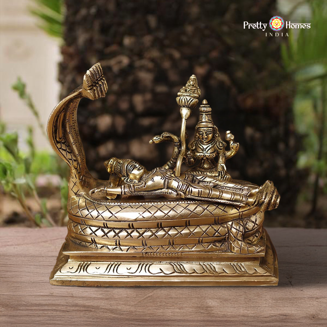 brass Vishnu and Lakshmi resting on Sheshnag in smooth gold finish
