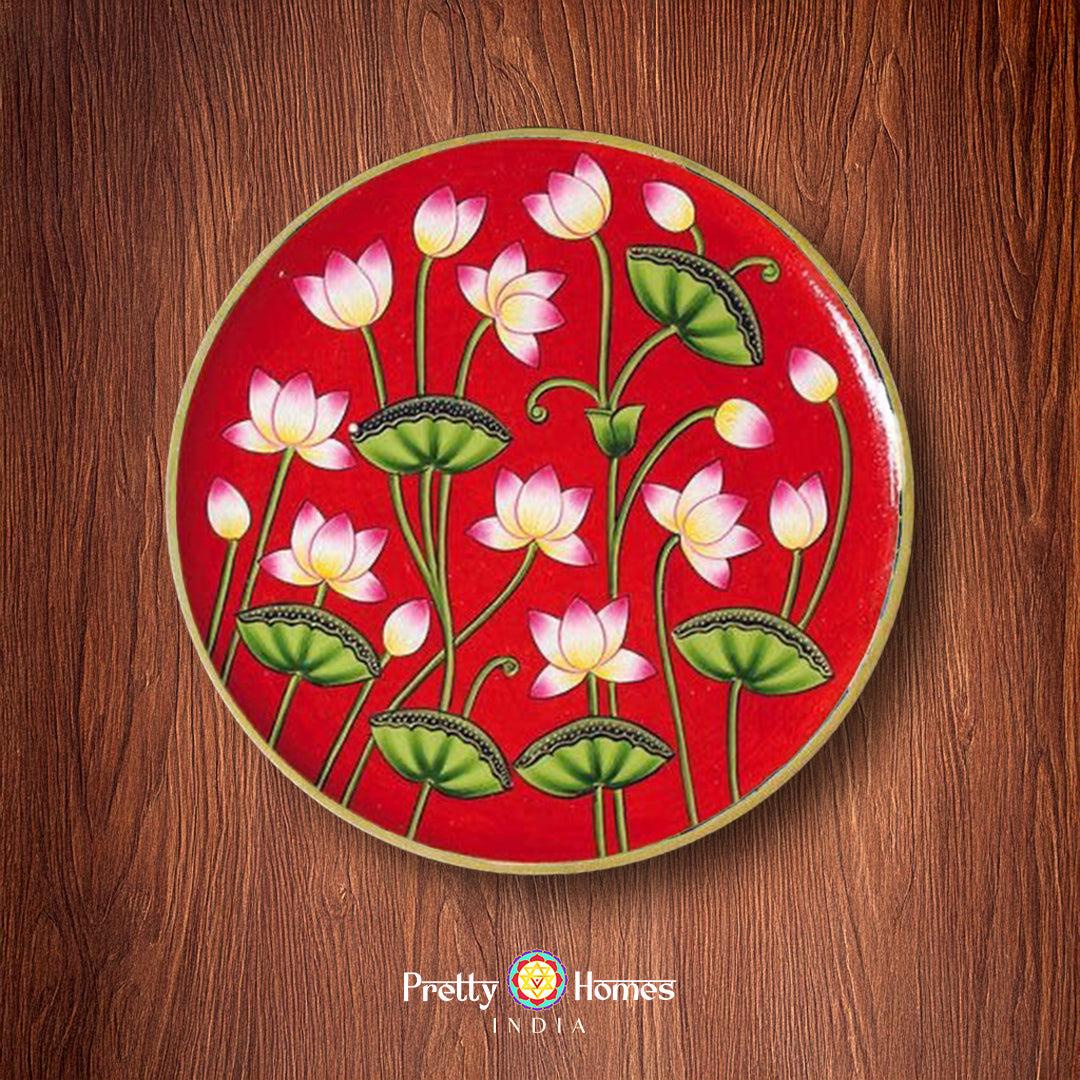 Hand painted wall plate with red base and lotus flowers, pichwai design