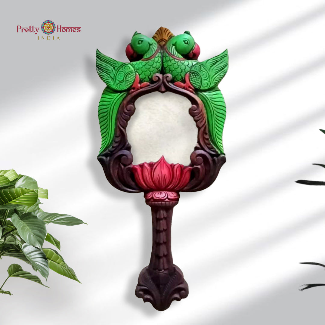 Wooden carved mirror frame with green parrot figures and multicolour finish