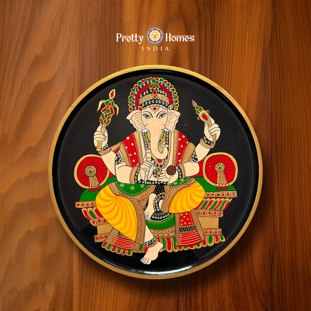 Hand-painted Lord Ganesha wall plate in Pichwai painting style on a black background. Ideal for Pichwai home decor.