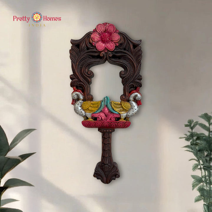 Exquisitely handcarved wooden mirror frame featuring majestic Annams and intricate floral motifs.