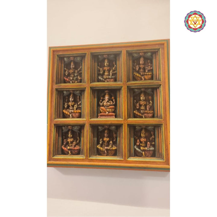 Side view of square Indian wall panel with 3x3 deity carvings