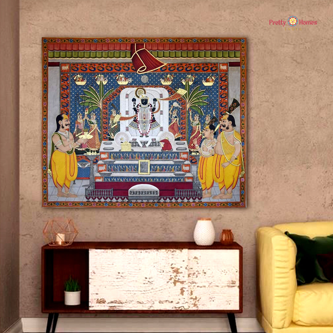 Traditional Pichwai panel with richly adorned Shrinathji surrounded by floral borders and symbols