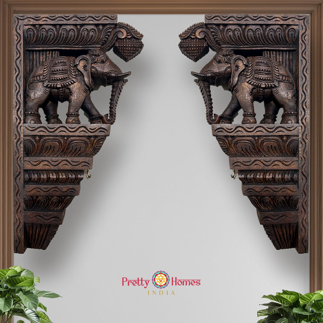Intricately carved wooden elephant wall bracket with antique finish
