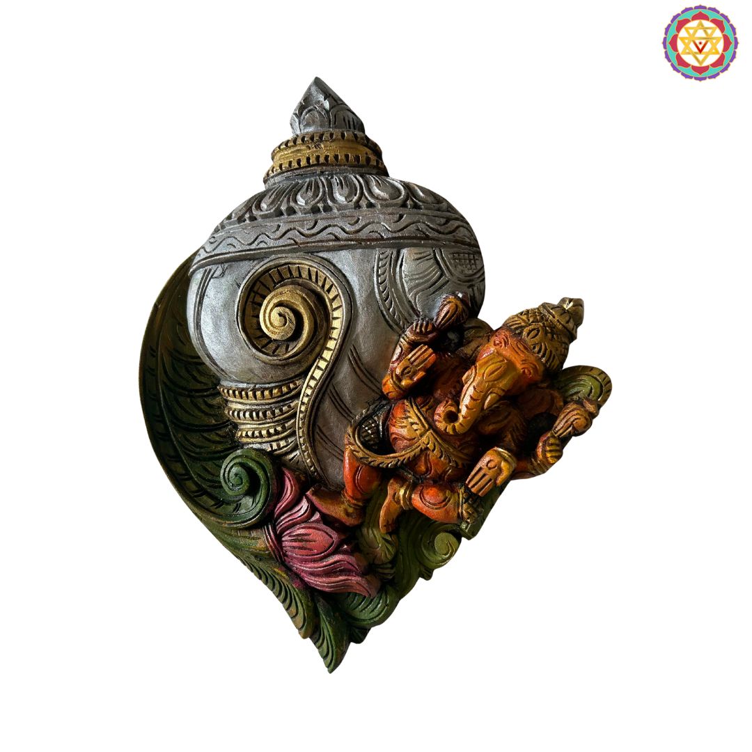 woodcarved conch/shankh wall frame with Ganehsa on lotus