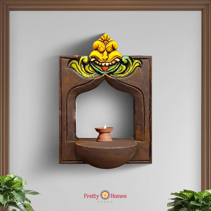 front view of hand-carved yali wooden frame displayed on a wooden stand showing the full sculpture and base in natural polished finish