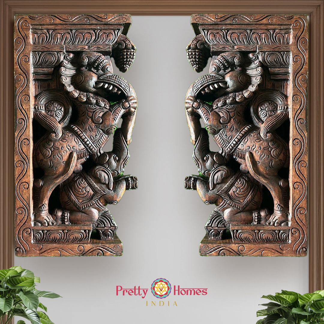 Front view of wooden Yali wall bracket showing carved elephant motif and mythical yali creature