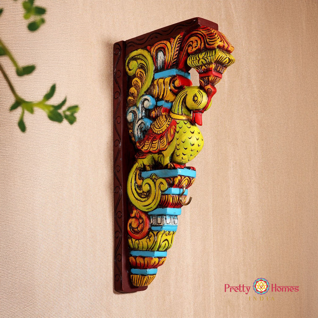 Close-up detailing of peacock border and Raas scene