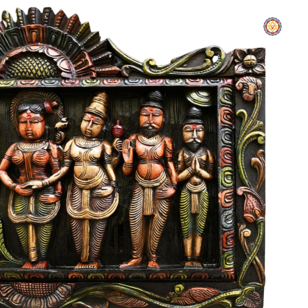 Side-angle of Meenakshi wedding panel — intricate traditional wood art.