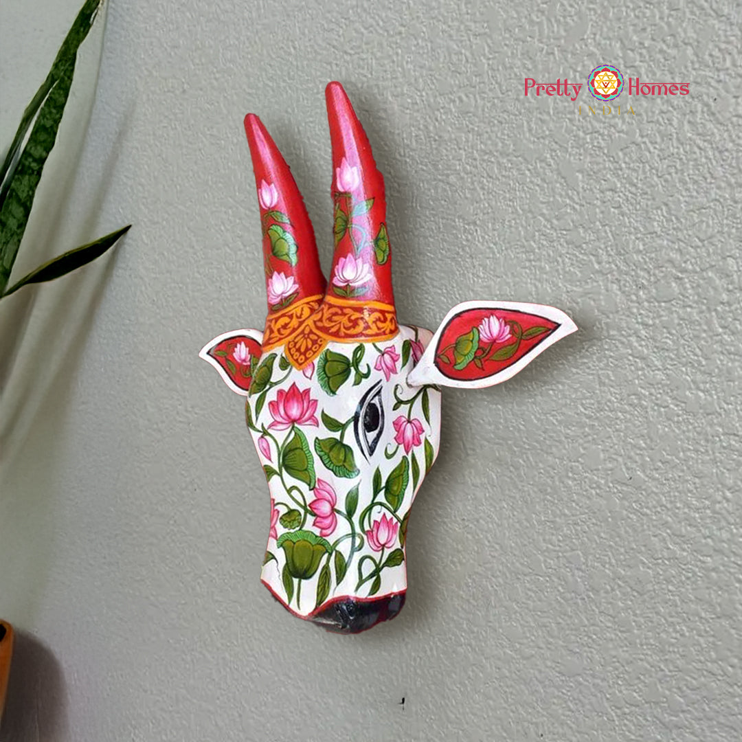 Wooden cow head wall hanging hand-painted with lotus and leaf motifs