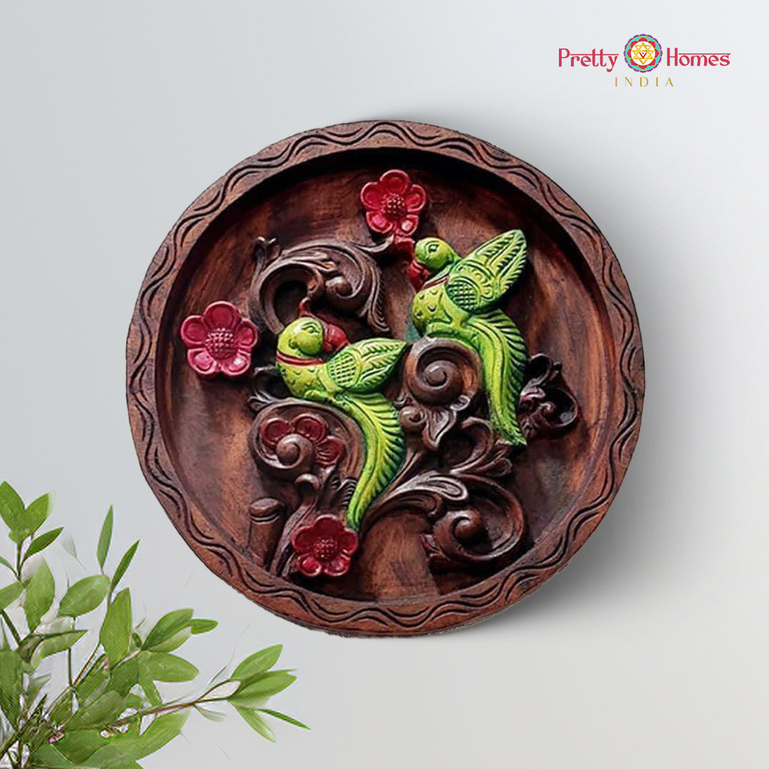 Handcarved wooden wall plate featuring parrots and floral motifs