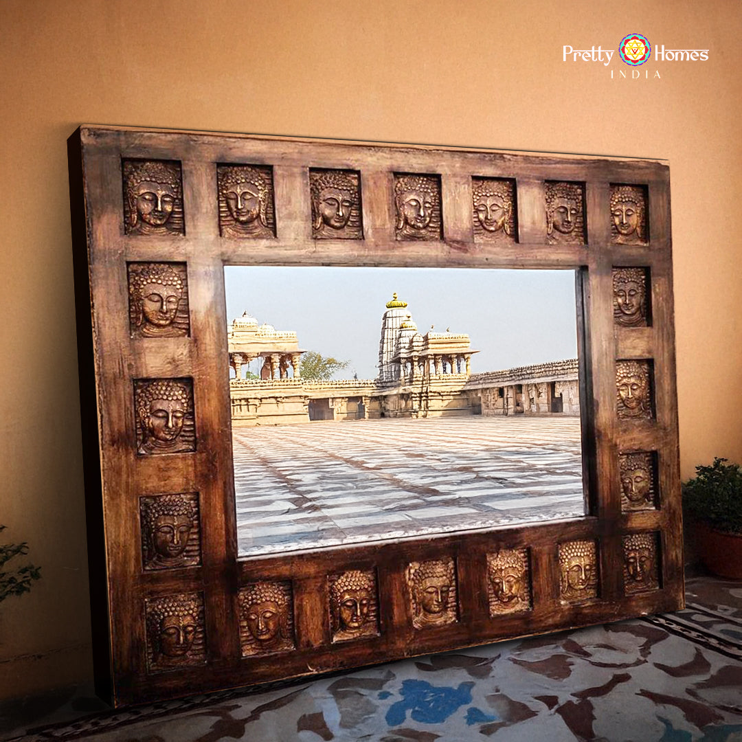 Front view of wooden mirror frame with brass Buddha design