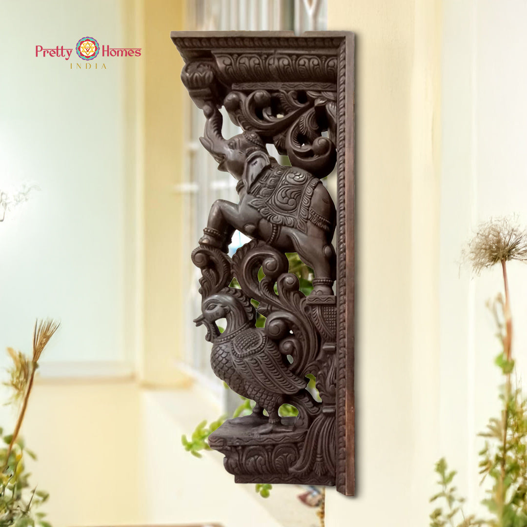 woodcarved trunk up elephant bracket with annams and vines
