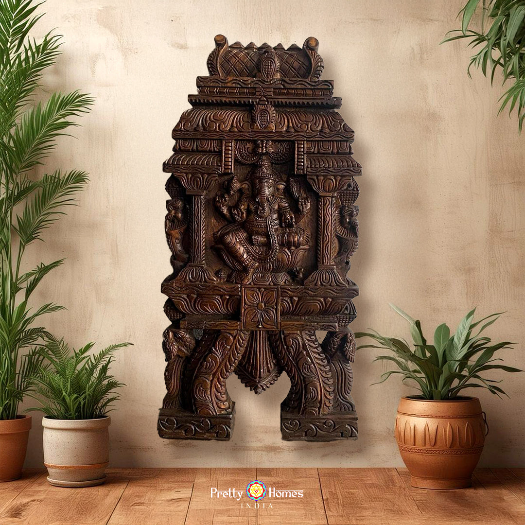 Carved wooden wall panel of Ganesha in gopuram style