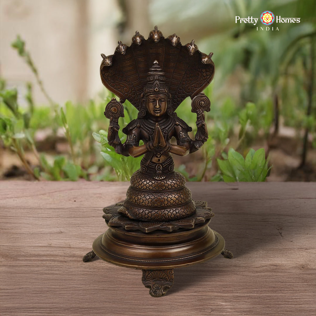 brass Kali statue with painted accents and antique finish