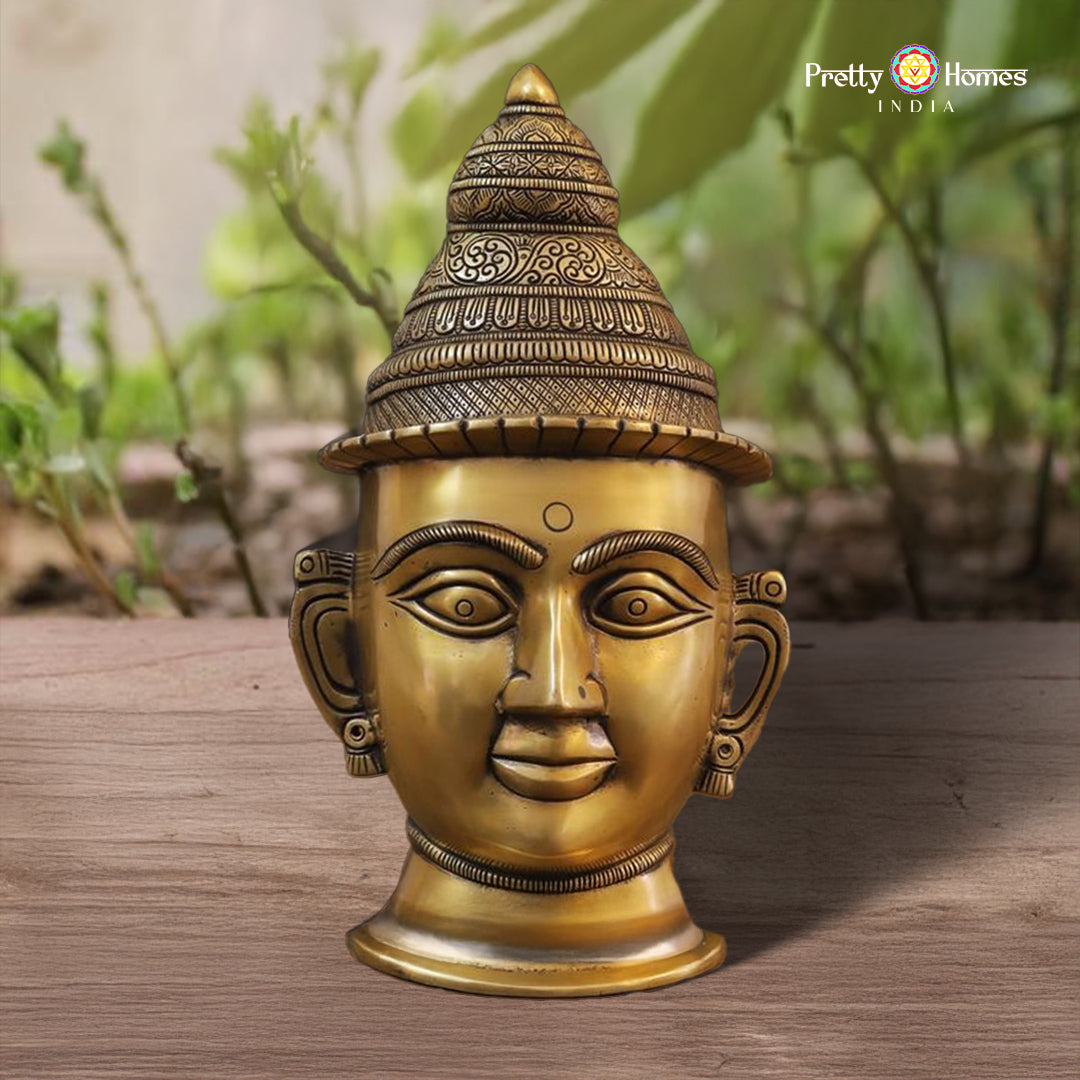 ornate brass Parvati head idol with handcrafted crown and serene expression