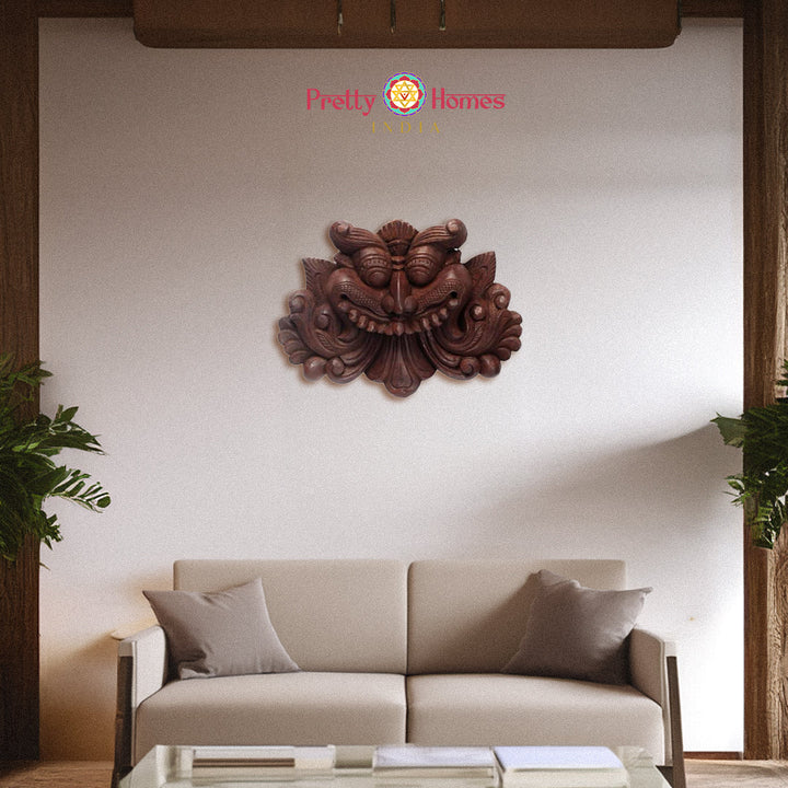 Hand-carved ornate wood decorative panel with mythical face motif in natural finish wall art.