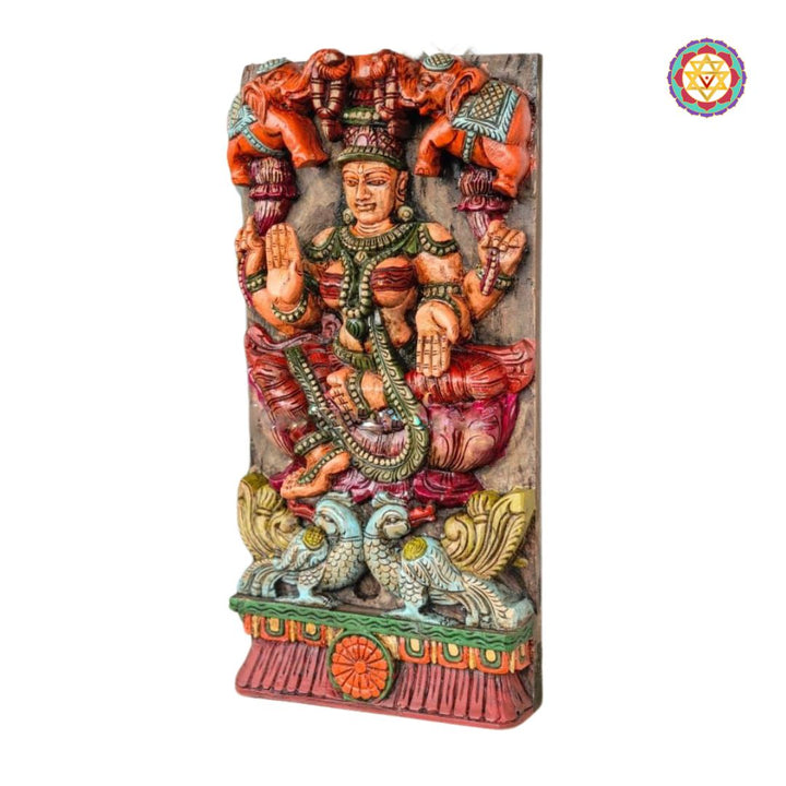 Decorative wall panel with a colorful sculpture of a deity on a white background - 