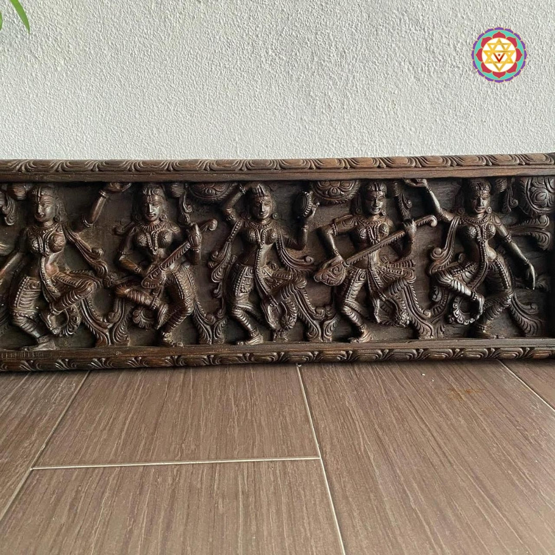 Hand-carved antique panel showing Apsaras playing instruments