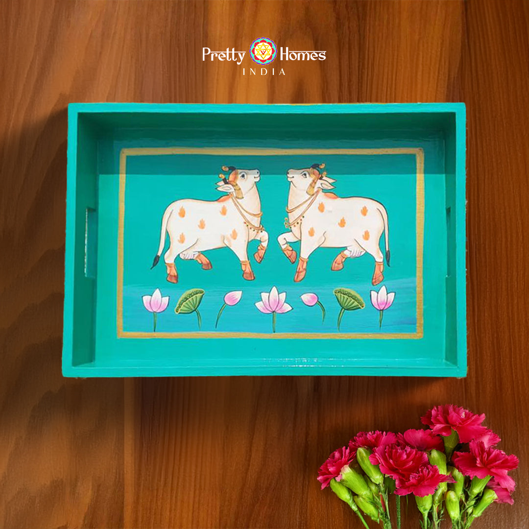 Aqua blue wooden Pichwai serving tray with hand-painted cows and lotus flowers.