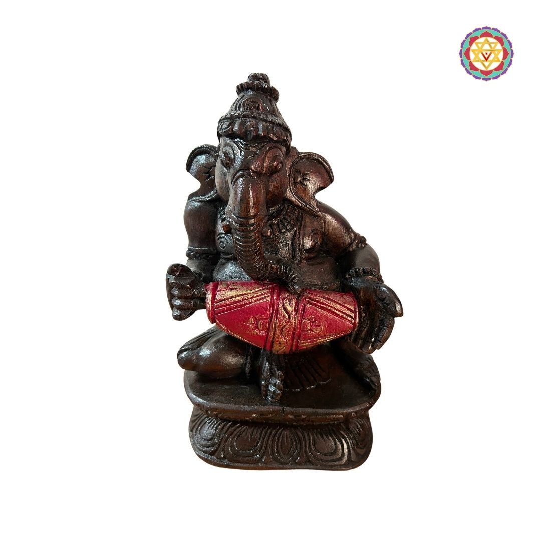 Ganesh figurine ensemble arranged in a decorative home altar setting