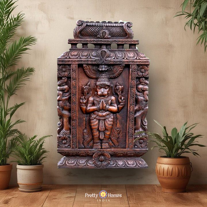 A woodcarved wall mount featuring an intricate depiction of Lord Hanuman in a traditional style, with a polished wooden finish.