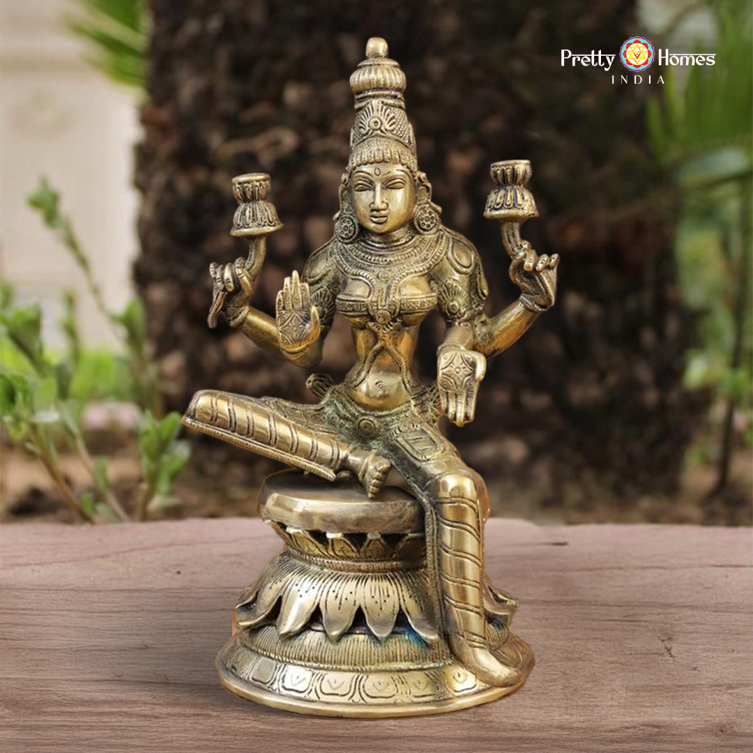brass Saraswati idol with veena symbolizing wisdom and grace