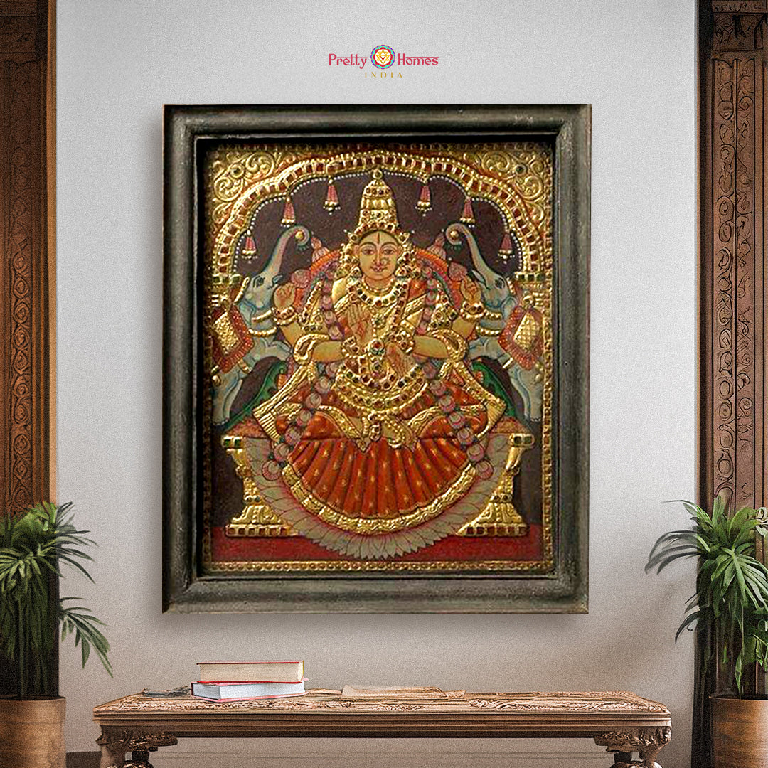 Framed vintage Gajalakshmi Tanjore painting in gold foil with royal posture
