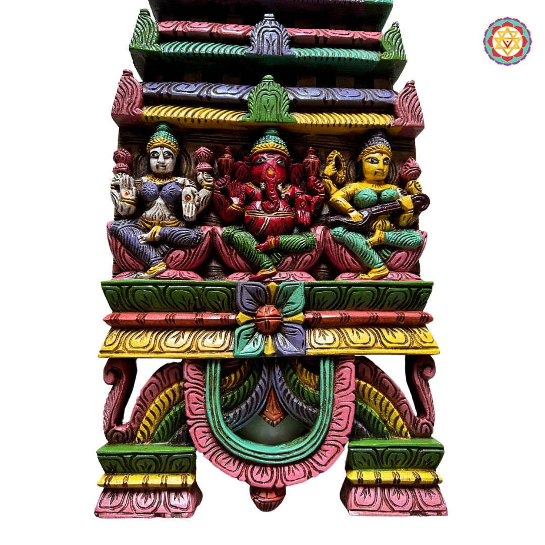 Angled view of Ganesha Laxmi Saraswati wall decor — antique finish with detailed wooden craftsmanship