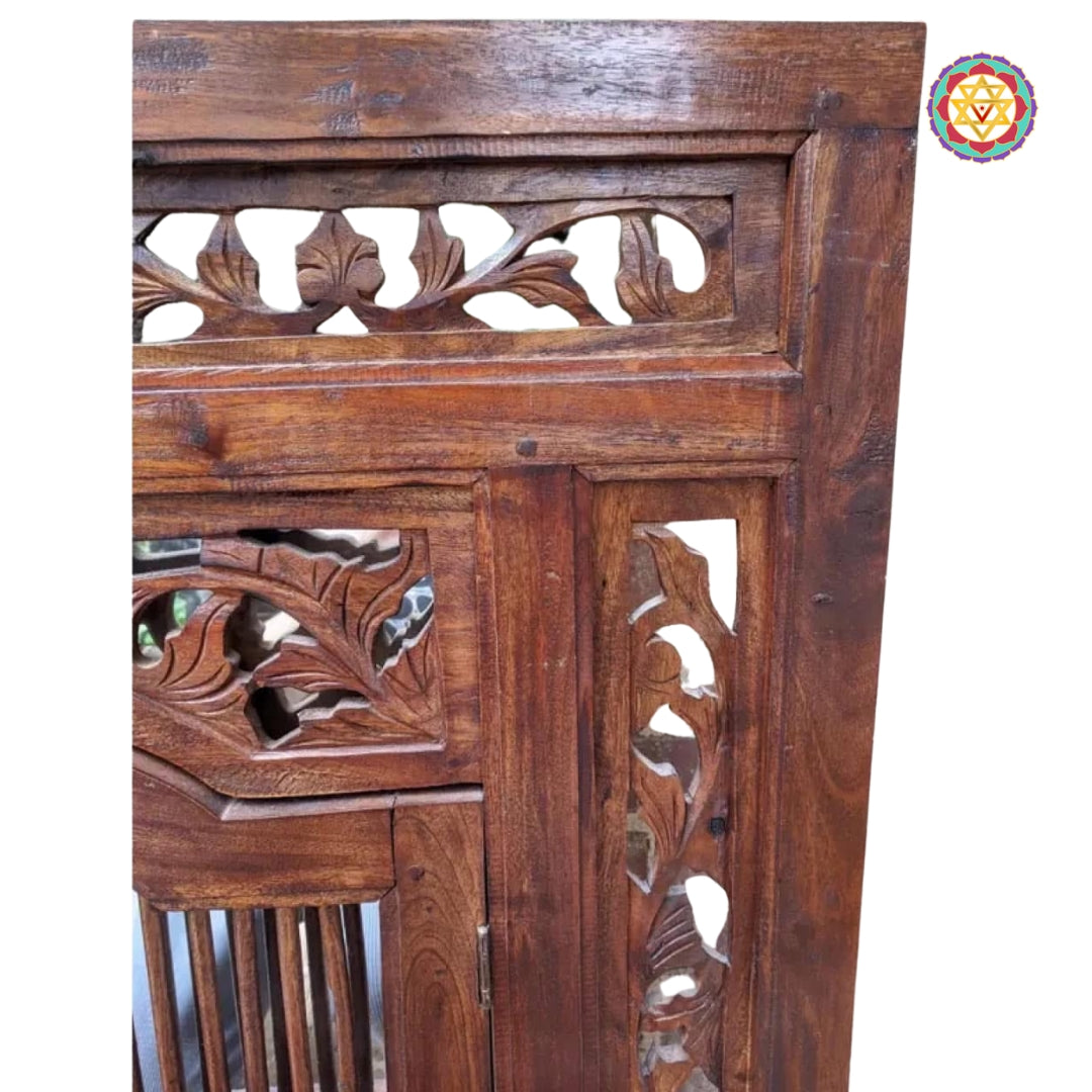 Close-up of floral carved motif on frame top