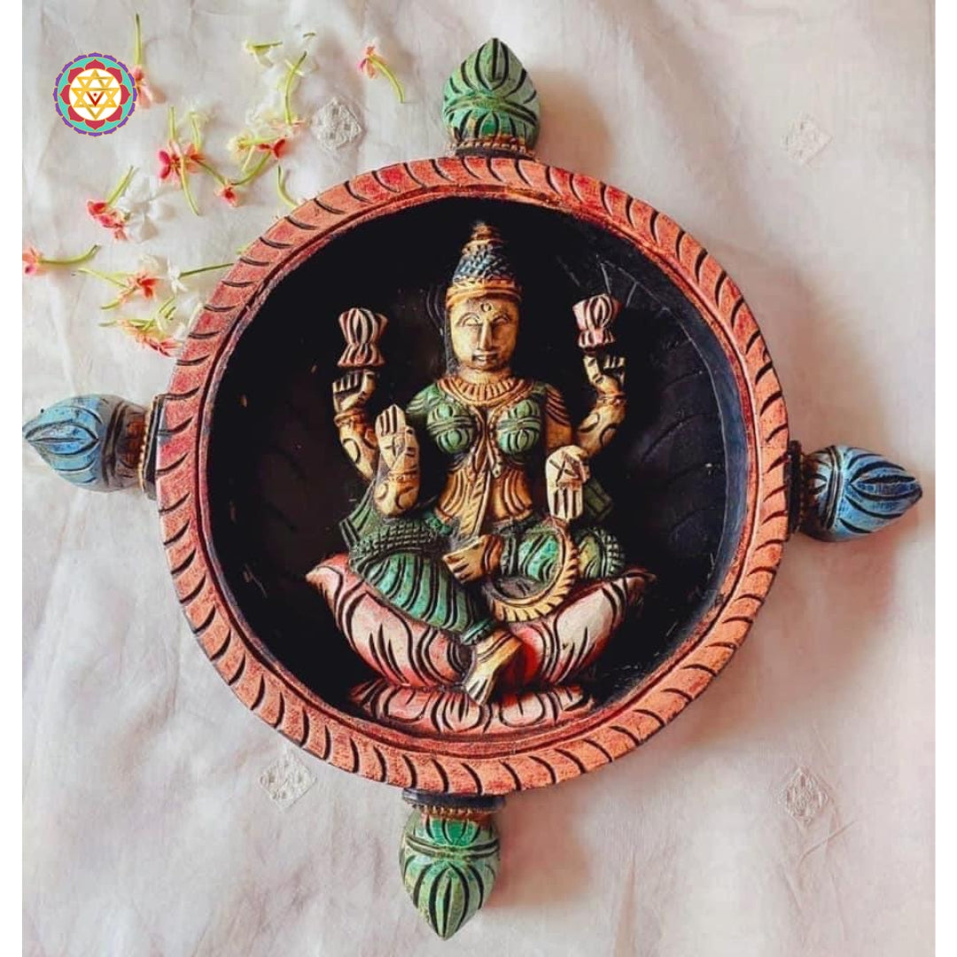 Wood carved round Goddess Laxmi