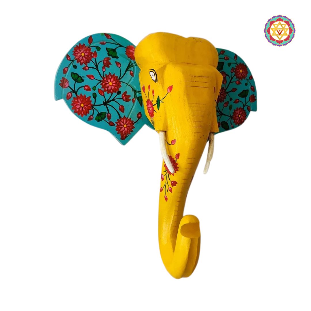 Side profile of hand-painted elephant head sculpture in antique finish