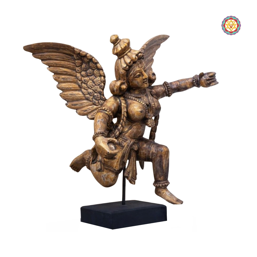 Side profile of Gandharva wood sculpture showing elegant body posture and handcarved textures