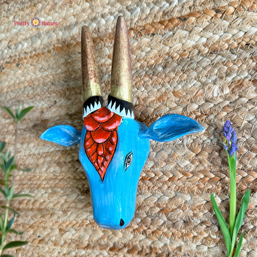 Angle detail of red blue Nandi wooden Nandi wall decor