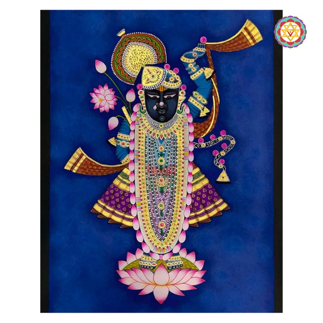 Close-up of shreenathji pichwai painting with blue background and floral lotus base.
