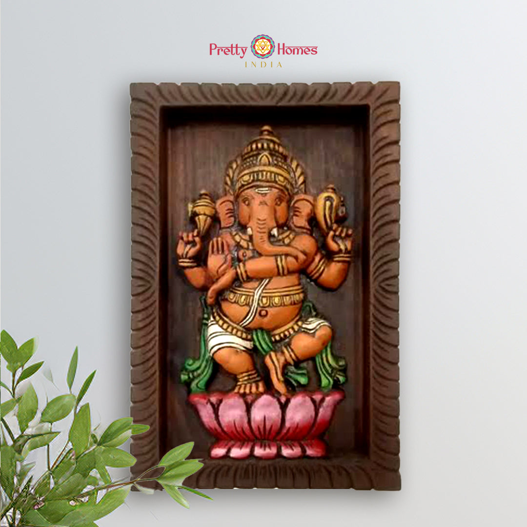 wooden carved dancing ganesha statue with joyful expression