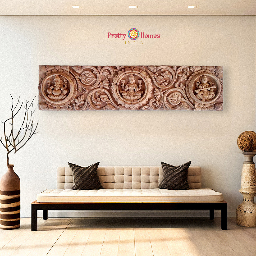 Wooden antique panel showing Ganesha, Lakshmi, and Saraswati – handcarved Indian temple art.