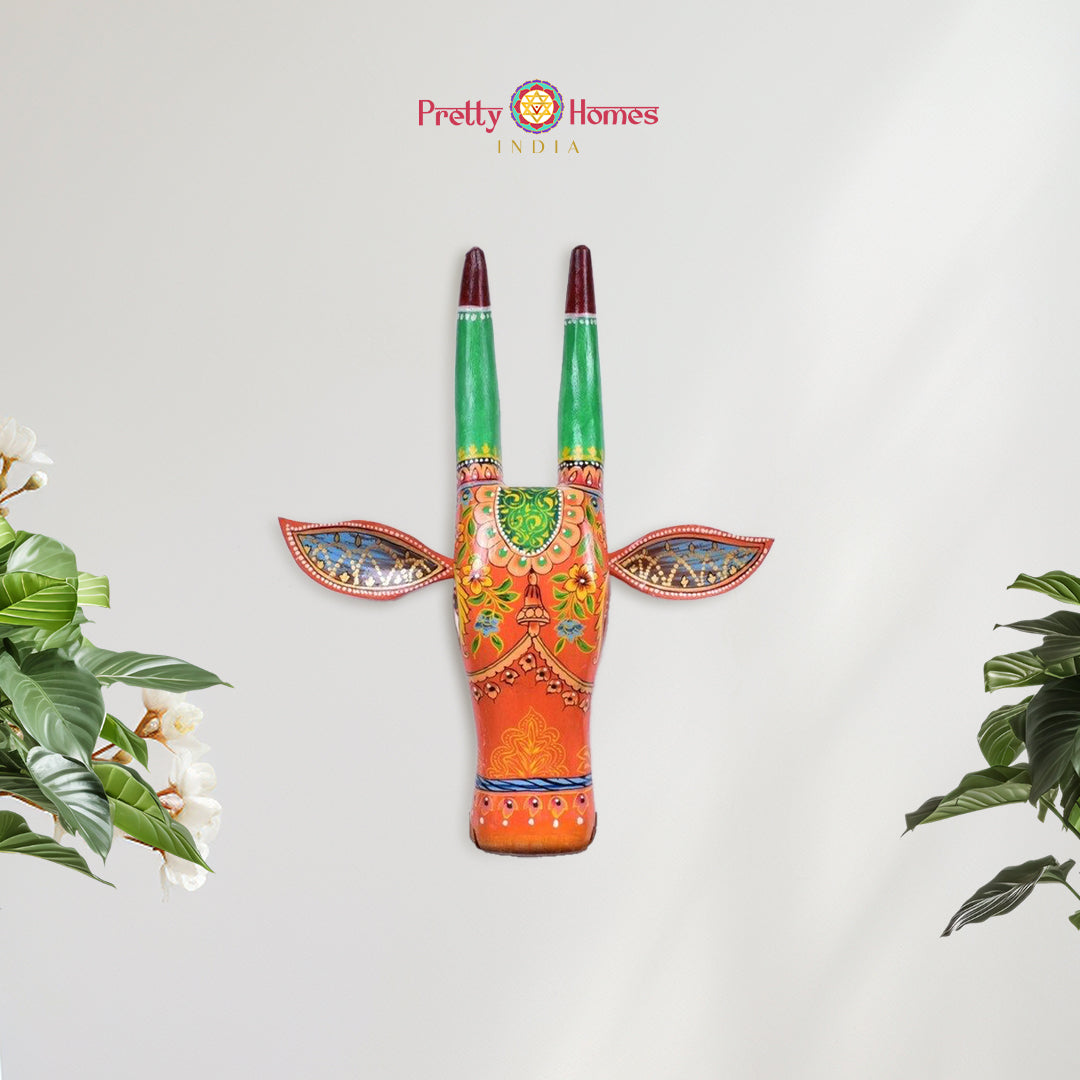 Hand-painted wooden cow head in multicolour floral design for wall decor