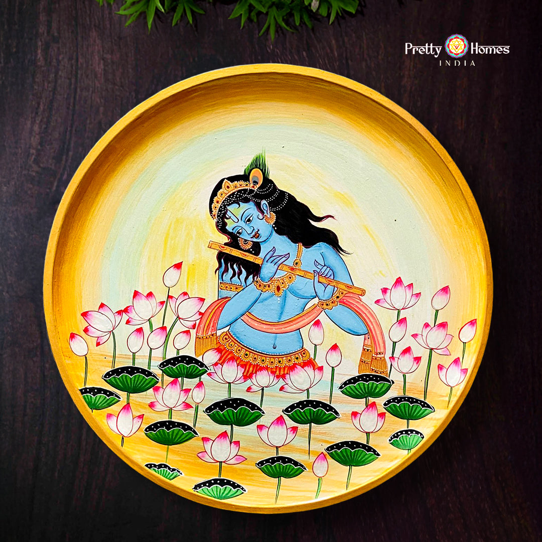 Round pichwai hand-painted flute Krishna artwork among sacred cows in devotional theme