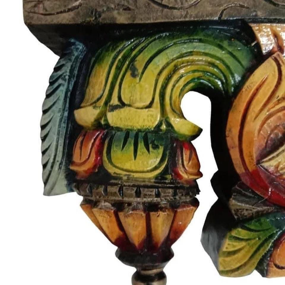 Angled shot of bodhil bracket showing annam swan motifs and polished finish