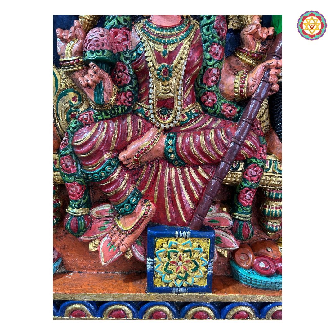 Side profile of Rajrajeshwari wall frame — detailed carving and layered prabhavali design, handcrafted antique polish