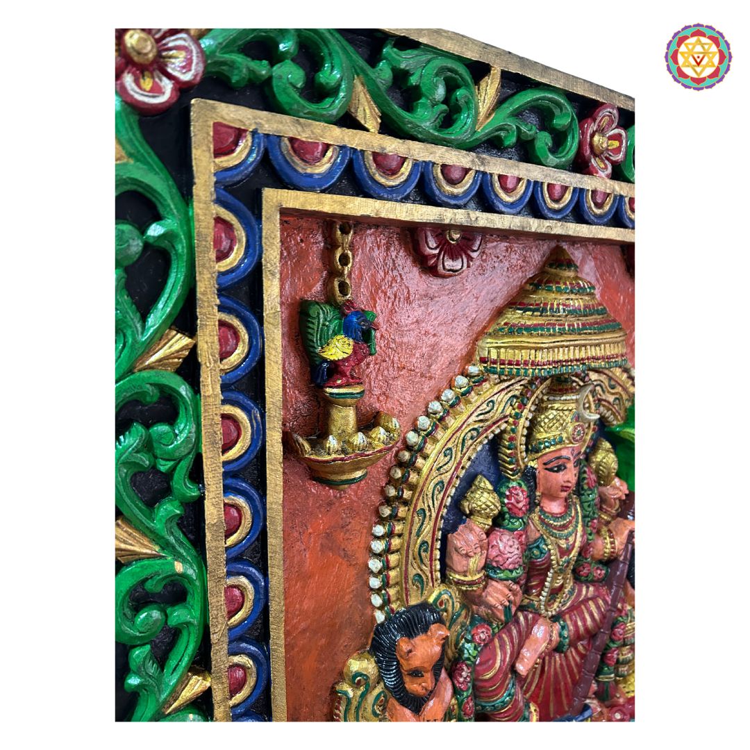 Angled top view of Rajrajeshwari panel frame — carved wooden border, antique gold finish devotional decor