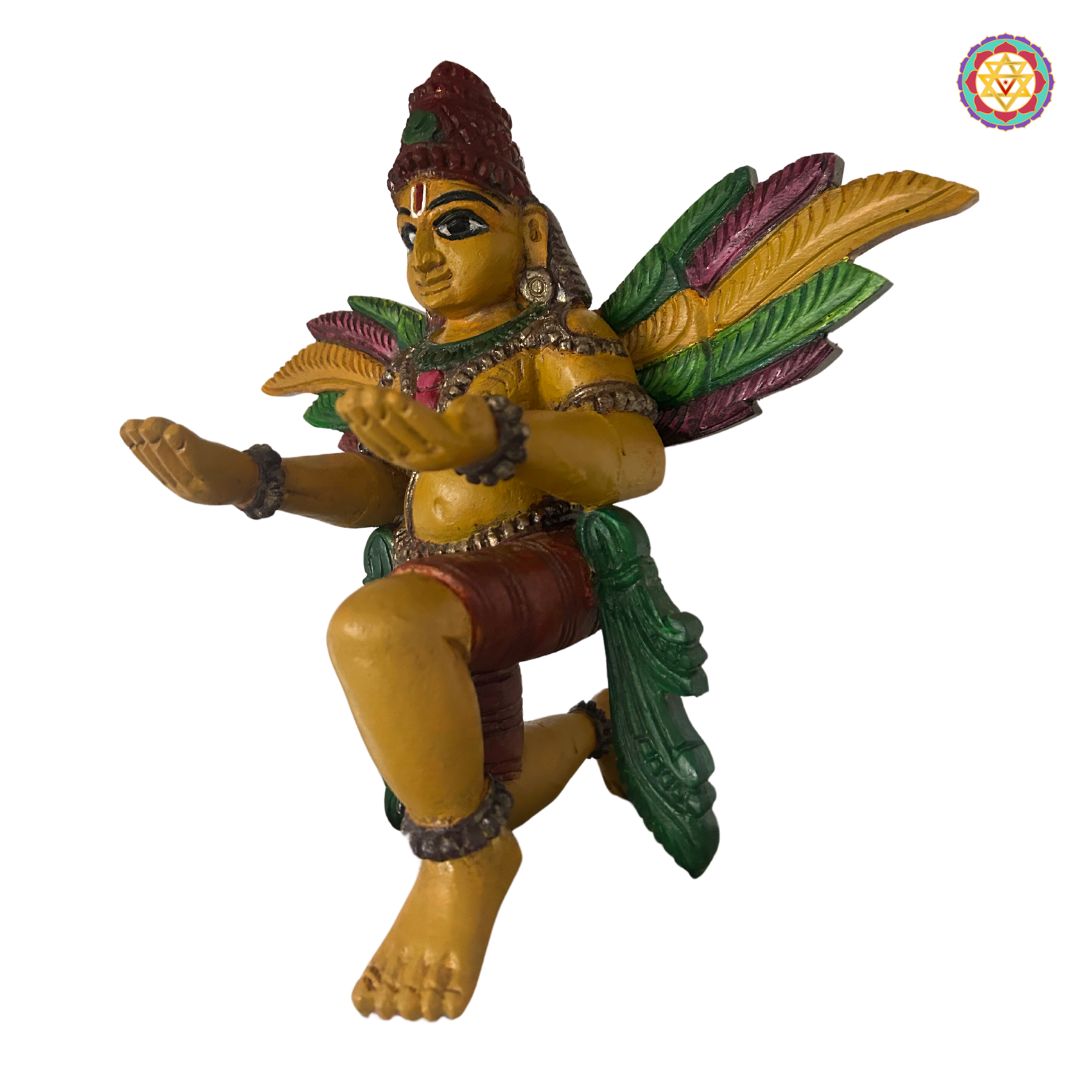 Side profile of Garuda sculpture — antique gold finish highlighting wing carving and body detailing, devotional home decor piece