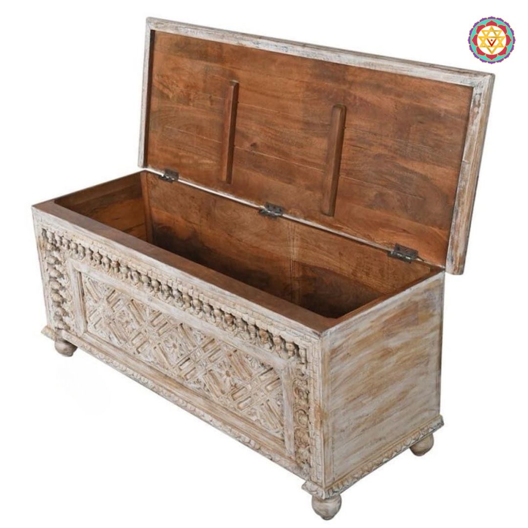 Side view of hand-carved trunk — smooth polish with traditional Indian spindle design, artisan wooden furniture